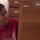 Matthew Flores showing off his bookcase now filled with books
KSL